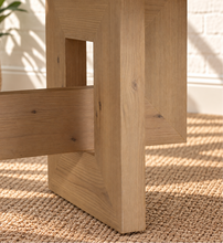 Load image into Gallery viewer, Millie rectangular natural oak dining table with geometric trestle base, central stretcher, and white oak veneer finish.
