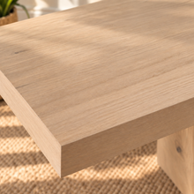 Load image into Gallery viewer, Millie rectangular natural oak dining table with geometric trestle base, central stretcher, and white oak veneer finish.
