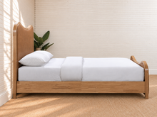 Load image into Gallery viewer, Miranda king-size natural wood bed in Toasted Caramel leather with sculptural curved headboard and footboard
