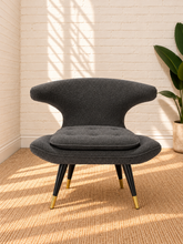 Load image into Gallery viewer, Image 1 of 4: Mirella upholstered lounge chair in Smoky Charcoal with sculptural back, plush seat, and brass-capped legs
