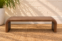 Load image into Gallery viewer, Molly natural brown mindi wood coffee table with rounded rectangular top and wide waterfall-style legs.
