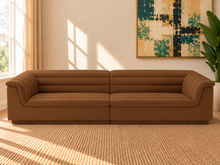 Load image into Gallery viewer, Monica 2-piece sectional sofa in Caramel velvet with deep horizontal channel tufting, curved arms, and contemporary design.
