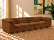 Load image into Gallery viewer, Monica 2-piece sectional sofa in Caramel velvet with deep horizontal channel tufting, curved arms, and contemporary design.
