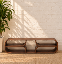 Load image into Gallery viewer, Montana natural brown mindi wood coffee table with a rectangular top, rounded corners, visible wood grain, and sculptural curved base.
