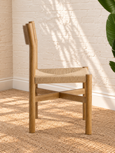 Load image into Gallery viewer, Amelie natural solid oak dining armchair with woven paper-rope seat, curved wood backrest, slim armrests, and X-shaped stretcher
