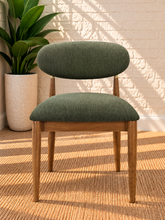 Load image into Gallery viewer, Nancy dining chair upholstered in Vintage Olive performance fabric with Brown Walnut Ash Wood frame and brushed brass accents
