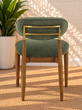 Load image into Gallery viewer, Nancy dining chair upholstered in Vintage Olive performance fabric with Brown Walnut Ash Wood frame and brushed brass accents
