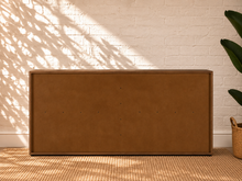 Load image into Gallery viewer, Nixon six-drawer dresser in warm walnut veneer with integrated vertical wood pulls and natural wood grain drawer fronts.
