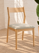 Load image into Gallery viewer, Nola dining chair with natural rubberwood frame, gray upholstered seat, curved wood backrest, and tapered legs
