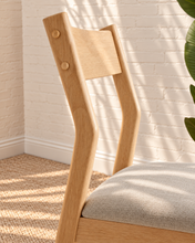 Load image into Gallery viewer, Nola dining chair with natural rubberwood frame, gray upholstered seat, curved wood backrest, and tapered legs
