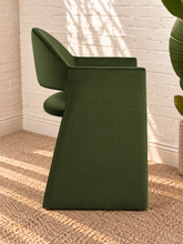 Load image into Gallery viewer, Nora olive green velvet dining armchair with curved barrel back, open-back design, angular arms, and upholstered panel base
