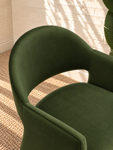 Load image into Gallery viewer, Nora olive green velvet dining armchair with curved barrel back, open-back design, angular arms, and upholstered panel base

