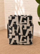 Load image into Gallery viewer, Nyla black and white geometric pattern upholstered accent chair with angular black wood arms and cushioned seat.
