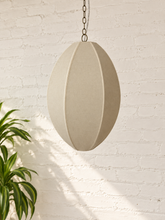 Load image into Gallery viewer, Penny hanging lamp in sand cotton rope with an elongated oval shade, raised vertical ribs, iron frame, and chain suspension.
