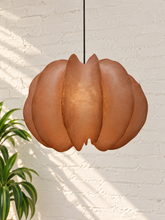 Load image into Gallery viewer, Piper hanging lamp in terracotta resin with overlapping curved panels, a rounded sculptural silhouette, textured surface, and dark cord suspension.
