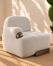 Load image into Gallery viewer, Quentin ivory gray upholstered accent chair with rounded arms, textured fabric and antique brass-finished metal accents.

