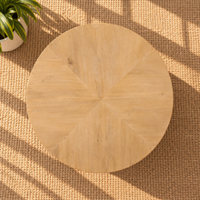 Load image into Gallery viewer, Rae coffee table in natural mango wood with a wide oval tabletop, rounded edges, and sculptural pedestal-style base.
