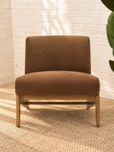 Load image into Gallery viewer, Raven mocha brown upholstered armless accent chair with exposed light wood frame, angled side supports and cushioned seat and back.
