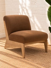 Load image into Gallery viewer, Raven mocha brown upholstered armless accent chair with exposed light wood frame, angled side supports and cushioned seat and back.
