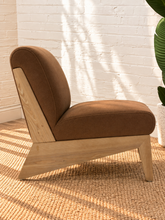 Load image into Gallery viewer, Raven mocha brown upholstered armless accent chair with exposed light wood frame, angled side supports and cushioned seat and back.
