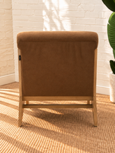 Load image into Gallery viewer, Raven mocha brown upholstered armless accent chair with exposed light wood frame, angled side supports and cushioned seat and back.
