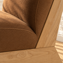 Load image into Gallery viewer, Raven mocha brown upholstered armless accent chair with exposed light wood frame, angled side supports and cushioned seat and back.
