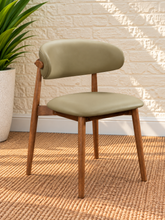 Load image into Gallery viewer, Reed Walnut dining chair upholstered in Desert Khaki vegan leather with curved backrest and solid wood frame
