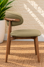 Load image into Gallery viewer, Reed Walnut dining chair upholstered in Desert Khaki vegan leather with curved backrest and solid wood frame
