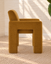 Load image into Gallery viewer, Reese ochre upholstered dining armchair with broad arms, angled legs, padded seat, and rounded backrest
