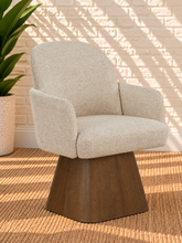 Load image into Gallery viewer, Rivas ivory upholstered swivel dining armchair with curved back and Brown Walnut solid wood base

