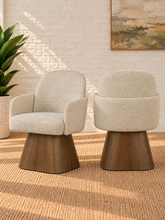 Load image into Gallery viewer, Rivas ivory upholstered swivel dining armchair with curved back and Brown Walnut solid wood base

