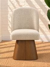 Load image into Gallery viewer, Rivas ivory upholstered swivel dining chair with curved back and natural walnut-finish base
