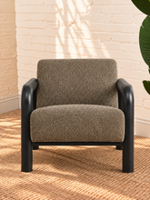 Load image into Gallery viewer, Riviera Onyx lounge chair with textured bouclé upholstery, rounded black wood arms, and padded seat and back
