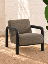 Load image into Gallery viewer, Riviera Onyx lounge chair with textured bouclé upholstery, rounded black wood arms, and padded seat and back

