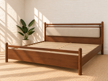 Load image into Gallery viewer, Rocco King platform bed with Walnut rubberwood frame, Greige heathered fabric headboard pillow, and faux leather straps.
