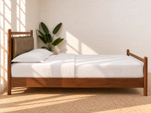 Load image into Gallery viewer, Rocco King platform bed with Walnut rubberwood frame, Taupe faux leather upholstered headboard pillow, and decorative leather straps.
