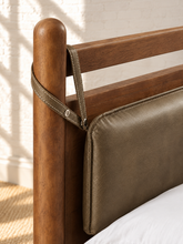Load image into Gallery viewer, Rocco King platform bed with Walnut rubberwood frame, Taupe faux leather upholstered headboard pillow, and decorative leather straps.
