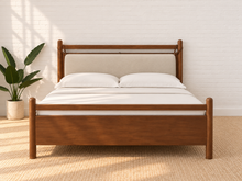 Load image into Gallery viewer, Rocco Queen platform bed with Walnut rubberwood frame, Greige heathered fabric headboard pillow, and faux leather straps.
