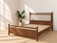 Load image into Gallery viewer, Rocco Queen platform bed with Walnut rubberwood frame, Greige heathered fabric headboard pillow, and faux leather straps.
