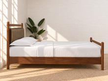 Load image into Gallery viewer, Rocco Queen platform bed with Walnut rubberwood frame, Taupe faux leather upholstered headboard pillow, and decorative leather straps.
