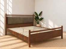 Load image into Gallery viewer, Rocco Queen platform bed with Walnut rubberwood frame, Taupe faux leather upholstered headboard pillow, and decorative leather straps.
