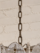 Load image into Gallery viewer, Rocio chandelier with layered clear and smoky sculptural glass pieces suspended from an iron frame and chain.
