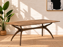 Load image into Gallery viewer, Image 1 of 4: Rubio 79-inch rectangular dining table in Natural Walnut with curved saber-leg trestle base and wood-look tabletop
