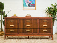 Load image into Gallery viewer, Mid-Century Walnut Long Dresser with Sculpted Details and Brass Pulls
