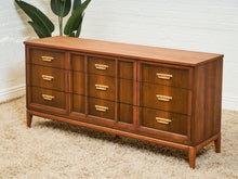 Load image into Gallery viewer, Mid-Century Walnut Long Dresser with Sculpted Details and Brass Pulls
