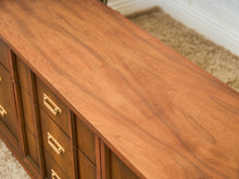 Load image into Gallery viewer, Mid-Century Walnut Long Dresser with Sculpted Details and Brass Pulls
