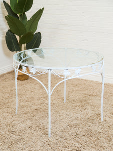 Vintage Wrought Iron Patio Dining Table with Leaf Motif Aqua Cushions and Glass Top