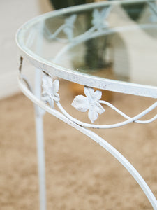 Vintage Wrought Iron Patio Dining Table with Leaf Motif Aqua Cushions and Glass Top