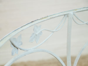 Vintage Wrought Iron Patio Dining Table with Leaf Motif Aqua Cushions and Glass Top