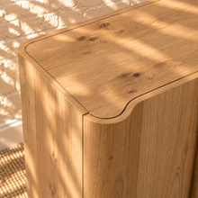Load image into Gallery viewer, Sadie natural oak four-door credenza with rounded edges, integrated legs, white oak veneer, and interior shelving.
